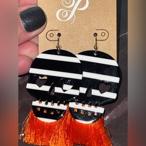 Plunder Black & White Striped Skull Earrings with Orange Tassels
